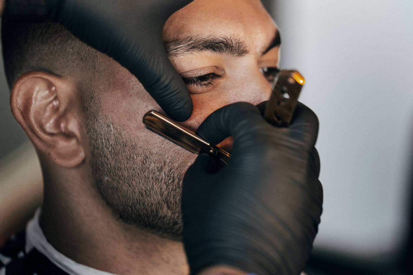 Barber at work with a professional grooming tool
