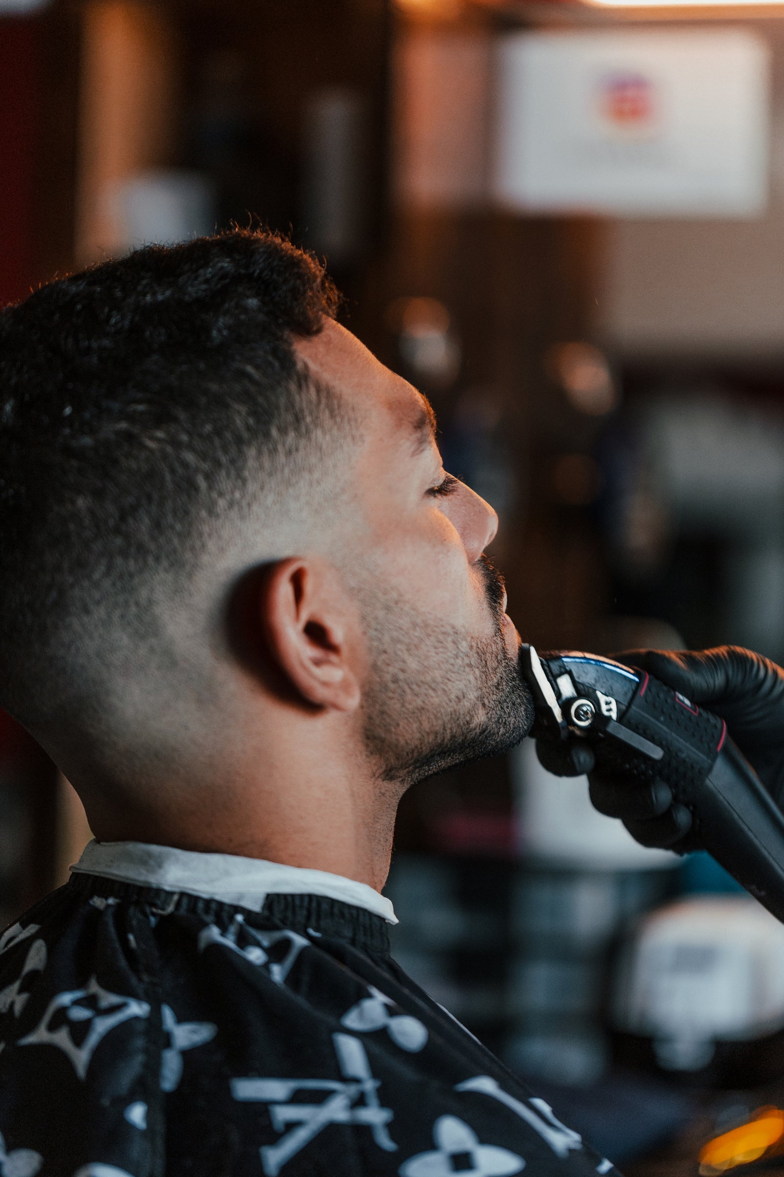 Professional barber detailing a beard